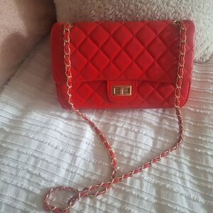 Red quilted shoulder bag.